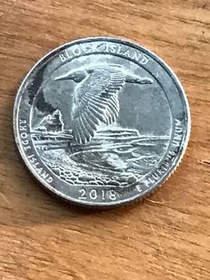 2018 quarter improperly annealed planchet error showing abnormal dark mottled surface discoloration from overheating or inadequate annealing